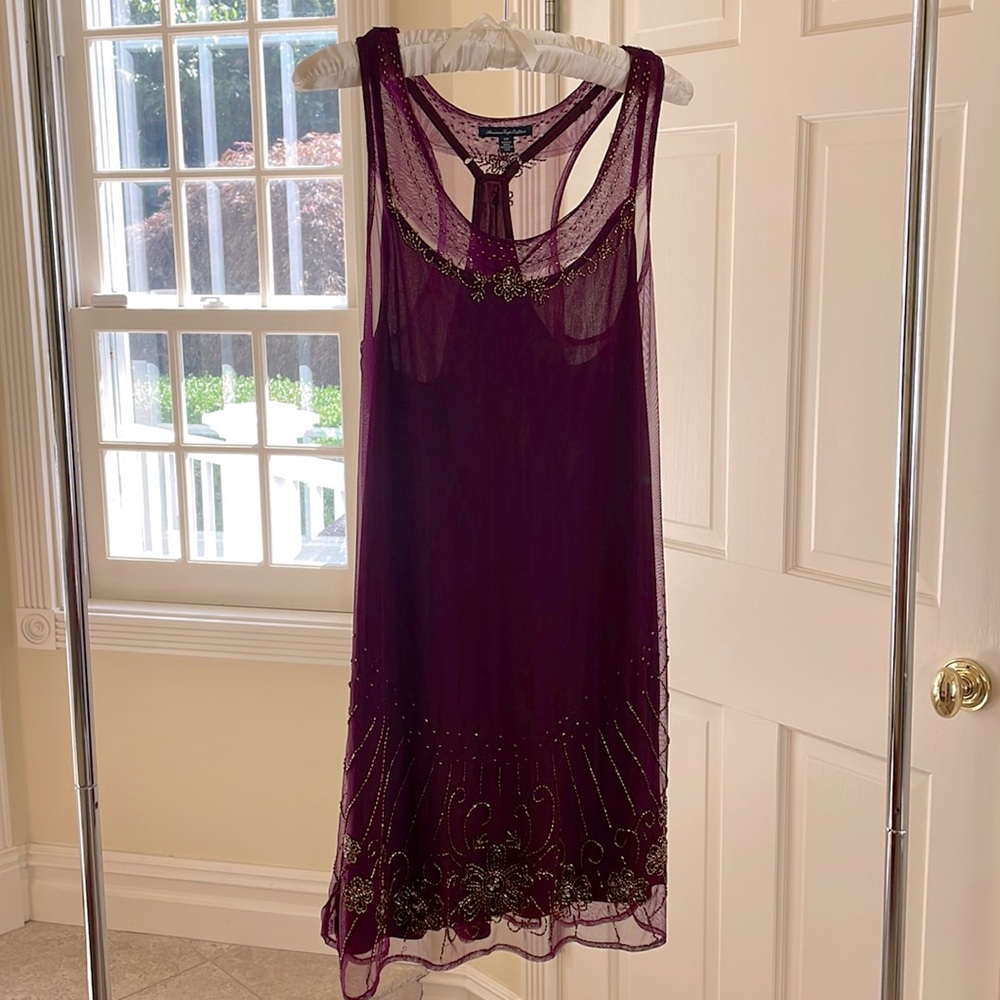 Like new plum, bugle beaded American Eagle racer back dress with slip.